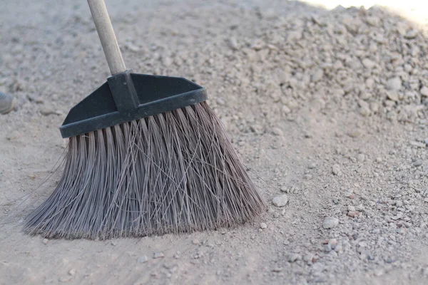 Tidy Territory Home Construction Broom Stones — Stock Photo, Image