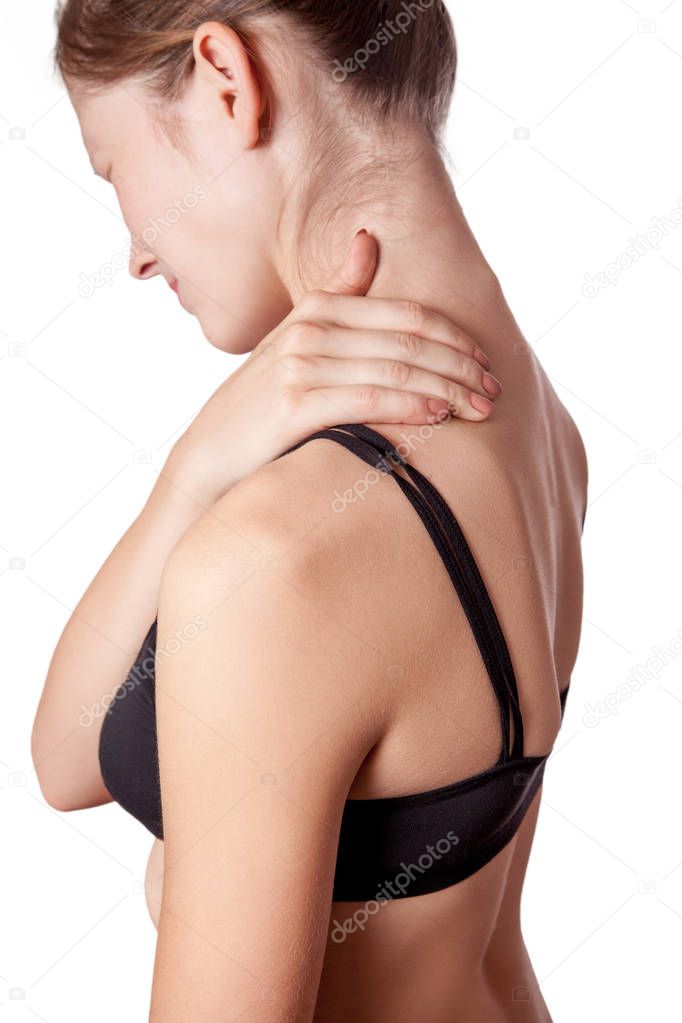 Closeup view of a young woman with shoulder or neck pain.