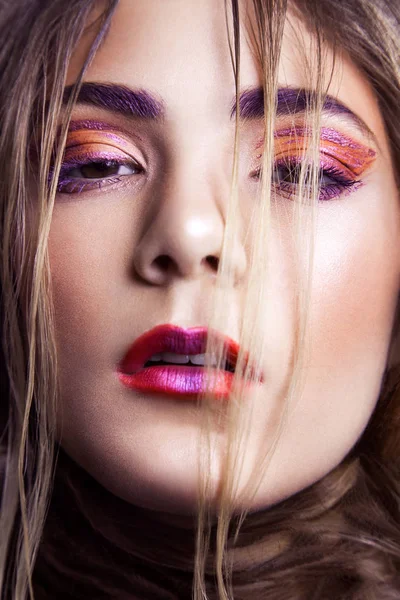 Closeup of beautiful fashion model with makeup and hairstyle on her face. — Stock Photo, Image
