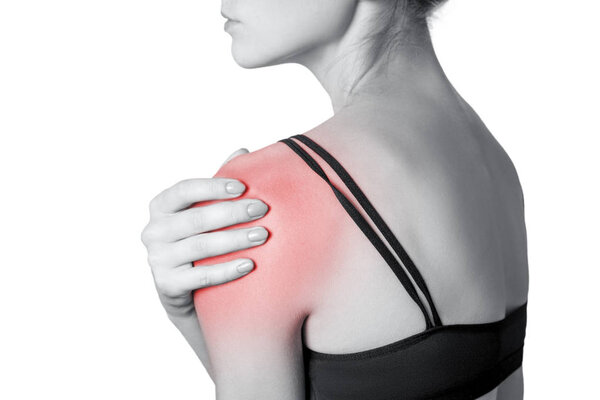 young woman with pain on her arm and shoulder. isolated on white background. Black and white photo with red dot