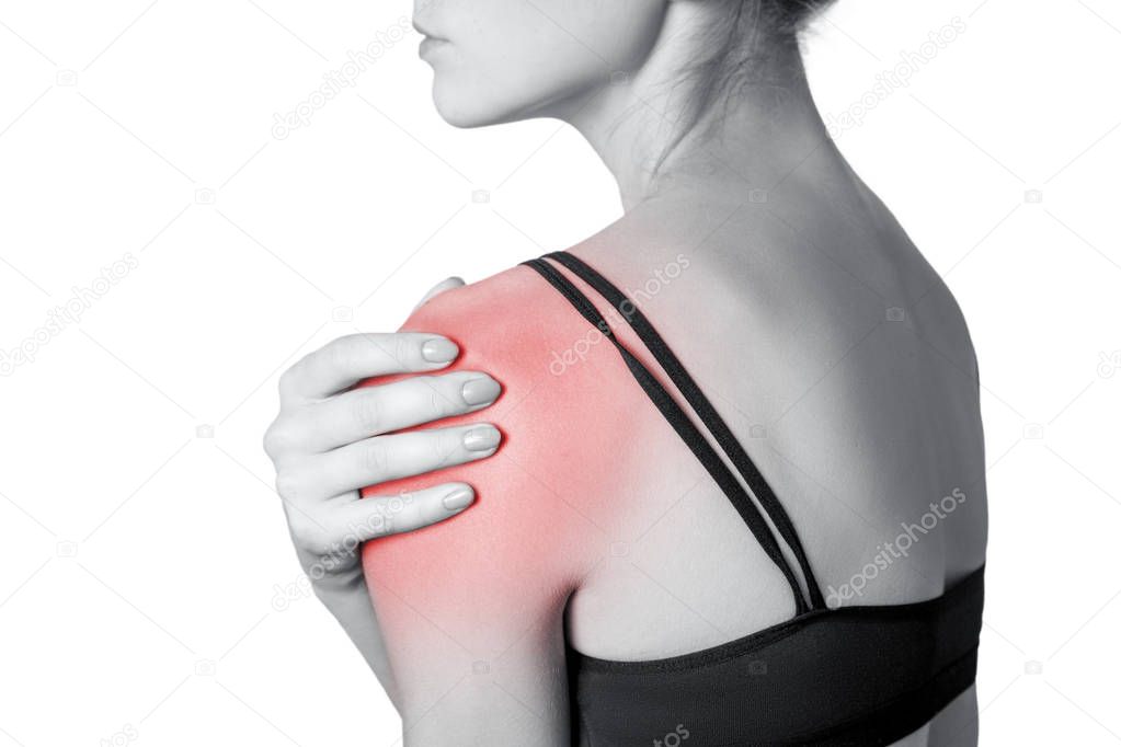 young woman with pain on her arm and shoulder. isolated on white background. Black and white photo with red dot