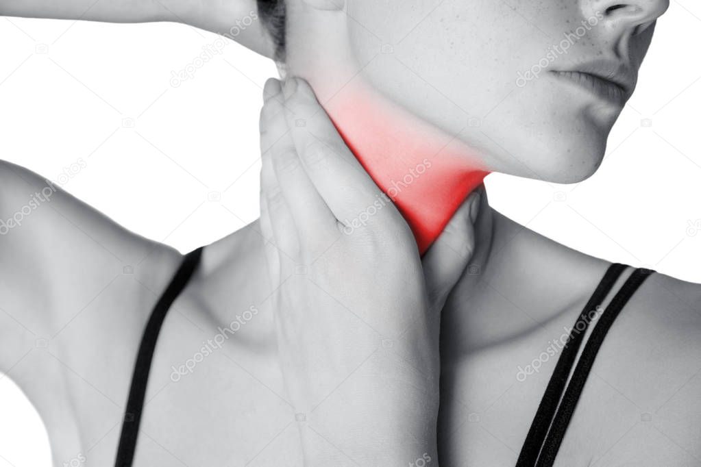Closeup view of a young woman with pain on neck or thyroid gland.  isolated on white background. Black and white photo with red dot.