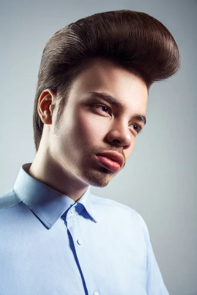 Side view of young man with retro classic pompadour hairstyle. studio shot. — Stock Image Side view of young man with retro classic pompadour hairstyle. studio shot. Royalty Free Stock Photos