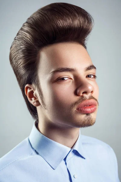 Portrait of young man with retro classic pompadour hairstyle. studio shot. looking at camera. — Stock Image Portrait of young man with retro classic pompadour hairstyle. studio shot. looking at camera. Stock Image
