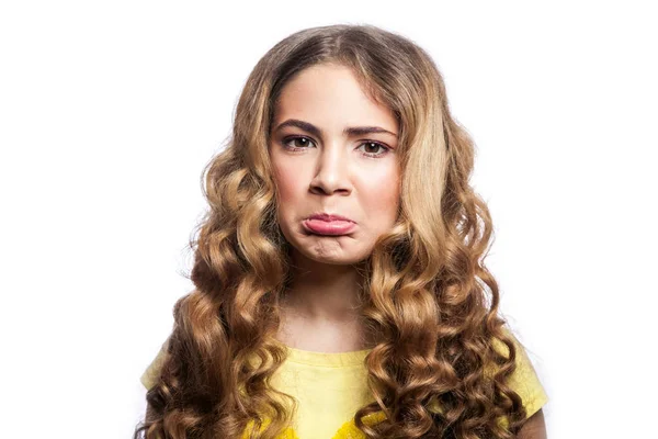 stock image Portrait of confused girl with wavy hairstyle and yellow t shirt. studio shot isolated on white background. 