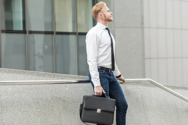 Young adult well dressed businessman wondering and dreaming for a new job. — Stock Photo, Image