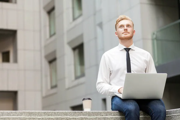 Young adult businessman working outsourcing and wondering . — Stock Photo, Image