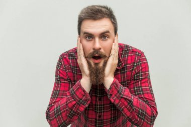 No way! Surprised young adult man with opened mouth and big eyes clipart