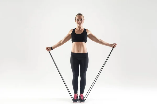 Woman holding skipping rope — Stock Photo, Image