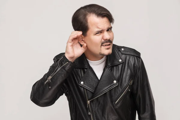 Man in leather jacket doesn't hear — Stock Photo, Image