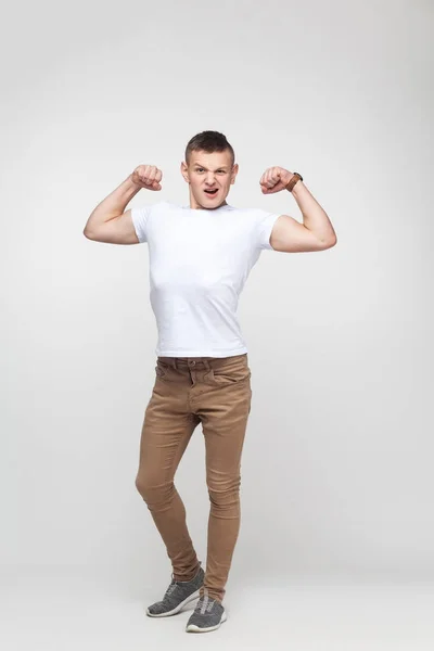 Happines Boy Showing Masculinity His Strong Camera Indoor Shot Gray — Stock Photo, Image