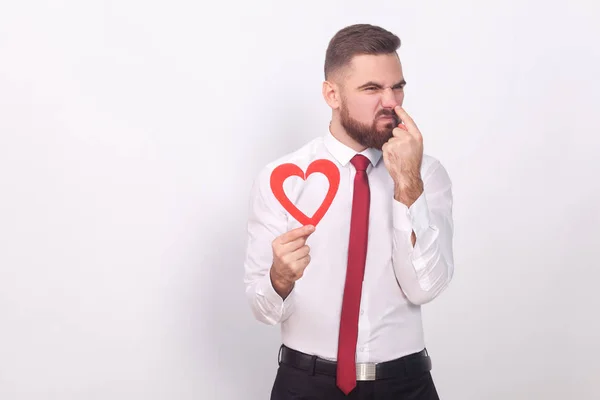 Hombre Negocios Sosteniendo Corazón Decorativo Señalando Con Dedo Nariz Concepto — Foto de Stock