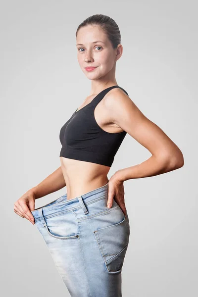 Close Slim Waist Young Woman Big Jeans Showing Successful Weight — Stock Photo, Image