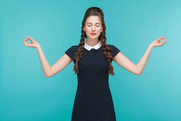 Businesswoman Black Dress Closed Eyes Doing Yoga Asana Blue Background — Stock Photo, Image