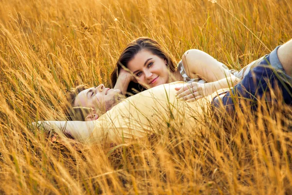 Loving Couple Lying Floral Field Autumnal Park Warm Sunny Day — Stock Photo, Image