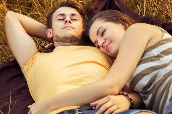 Loving Couple Embracing Dreaming While Lying Floral Field Autumnal Park — Stock Photo, Image