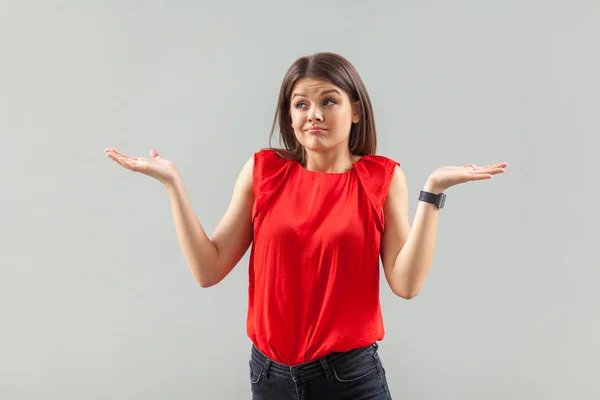 Confused Beautiful Brunette Young Woman Red Shirt Standing Raised Arms — Stok fotoğraf