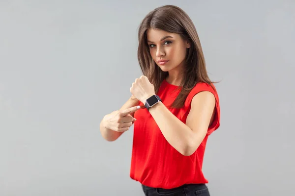 Serious Beautiful Brunette Young Woman Red Shirt Looking Camera Pointing — Stok fotoğraf