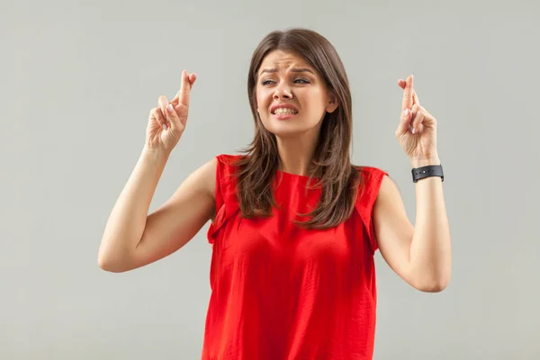 Hopeful and nervous. Portrait of worry brunette young woman in r — Stock Photo, Image