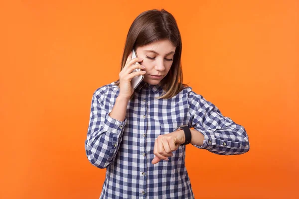 Portrait of worried young woman with brown hair wearing checkere — Stock Photo, Image