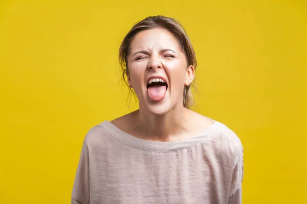 Portrait of young naughty woman with blonde hair in casual beige — Stock Photo, Image