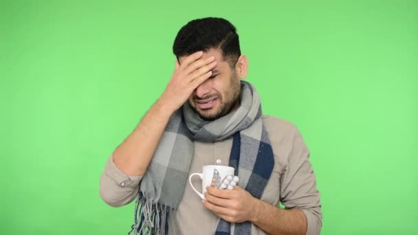 Unhappy Worry Sick Young Adult Man Scarf Holding Cup Pills — Stock Video