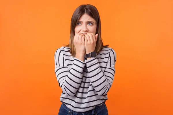 Portrait of nervous depressed young woman with brown hair in lon — Stock Photo, Image