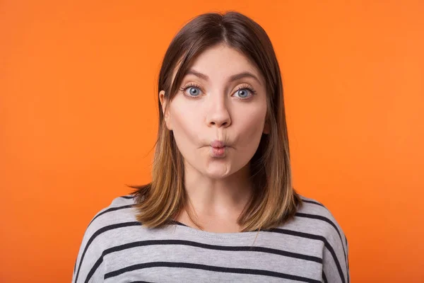 Portrait of funny young woman with brown hair in long sleeve str — Stock Photo, Image