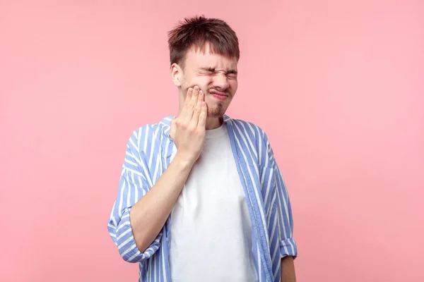 Portrait of sick young brown-haired man suffering terrible tooth — Stock Photo, Image