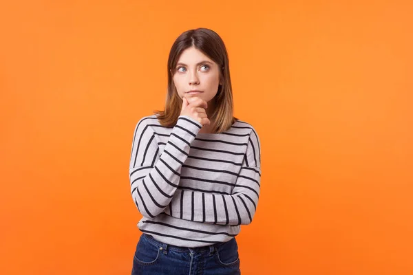 Think up plan. Portrait of pensive woman with brown hair in long — Stock Photo, Image