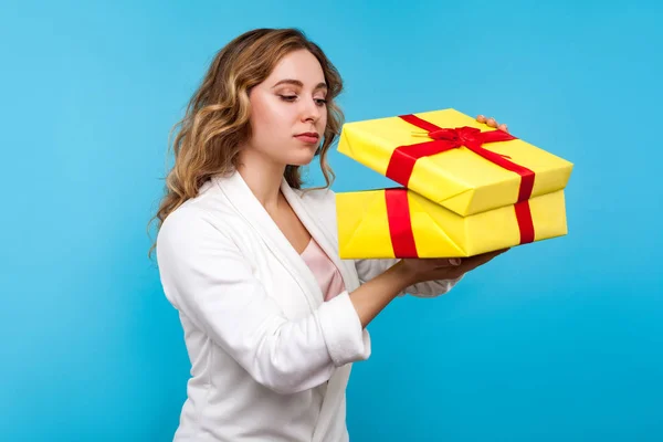Portrait of charming woman peeking with curious look into gift b — Stock Photo, Image