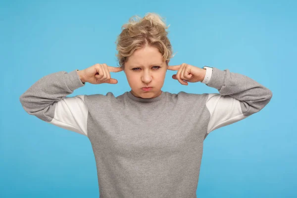 Don't want to hear! Irritated woman in grey sporty sweatshirt co — Stock Photo, Image