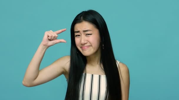 Positive Asian Woman Long Black Hair Making Little Bit Gesture — 비디오