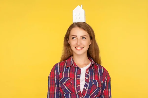 Portrait of pretty girl in checkered shirt and with paper house — Stock Photo, Image