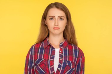 Portrait of unhappy ginger girl in checkered shirt frowning and  clipart