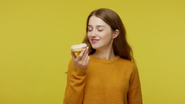 Nice Girl Pullover Eating Sweet Donut Looking Surprise Camera Feeling — стоковое видео