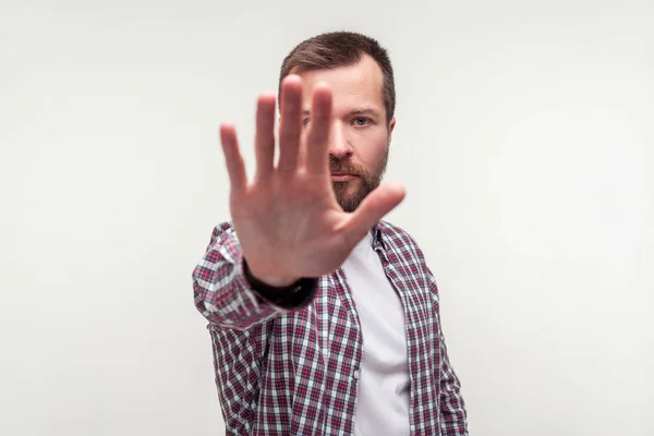 Stop! Portrait of bossy bearded man holding out palm to camera, — Stock Photo, Image