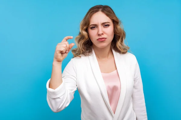 Some more please. Portrait of displeased woman making a little b — Stock Photo, Image