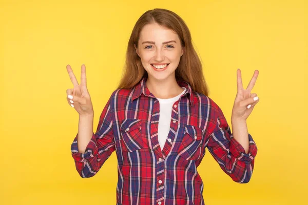 Portrait of happy successful ginger girl in checkered shirt doin — 스톡 사진