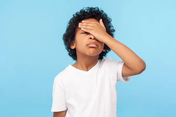 Facepalm. Portrait of forgetful upset little boy with curls cove — 스톡 사진