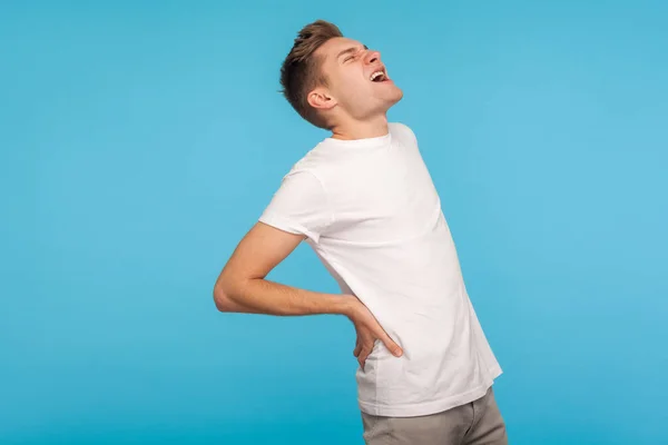 Acute back ache. Unhealthy man shouting from sudden pain in lowe — Stock Photo, Image