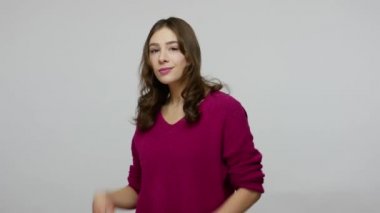 Hey you, handsome! Lovely joyful brunette woman with engaging smile pointing finger to camera and winking