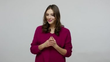 Female hopes and dreams. Nice-looking brunette woman in pullover imagining something pleasant