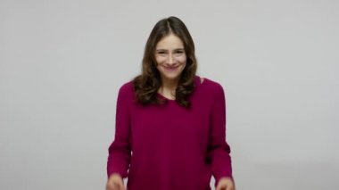 I need cash. Joyful nice-looking brunette woman in pullover showing money gesture and smiling slyly