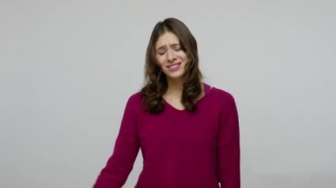 Upset stupid brunette woman with bad memory doing facepalm gesture and blaming herself for mistake