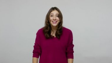 Come into my arms! Charming friendly hospitable brunette woman in pullover holding hands wide open to hug you