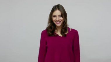 Blog trends, viral topics. Nice-looking happy brunette woman in pullover making hashtag symbol