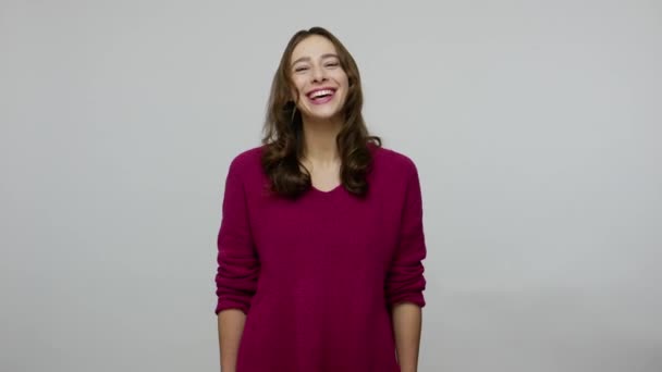 Happy overjoyed nice-looking brunette woman in pullover holding stomach and laughing out loud — Stok video