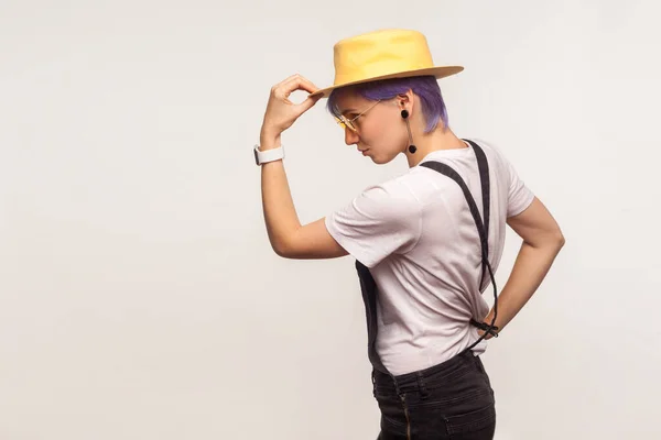 Side view portrait of elegant stylish hipster girl holding hat o — Stock Photo, Image