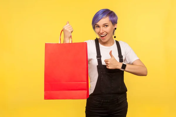 Portrait of happy buyer, nice hipster girl with violet short hai